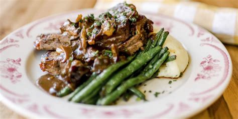 best-bacon-wrapped-meatloaf-with-mushroom-gravy image