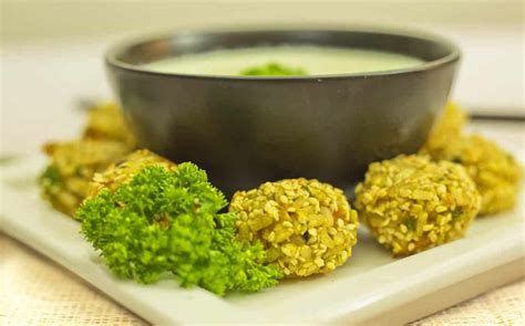 turmeric-veggie-rice-balls-with-sesame-seeds-love image