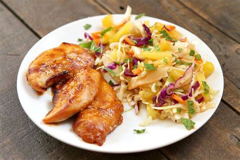 thai-chicken-tenders-with-broiled-pineapple-slaw image