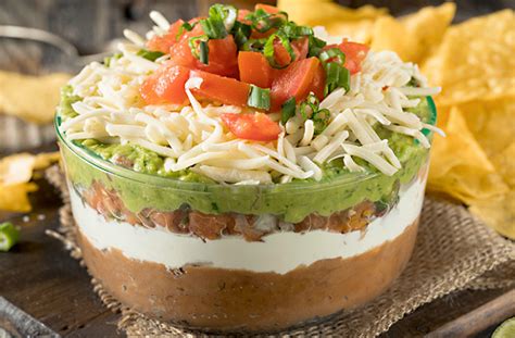 8-layer-mexican-fiesta-dip-recipe-farm-and-dairy image