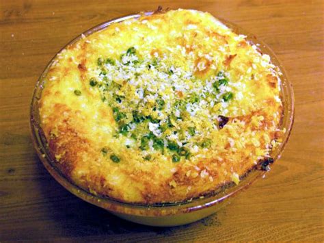 giadas-baked-mashed-potatoes-with-peas-parmesan image