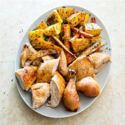 best-roast-chicken-with-root-vegetables-cooks-illustrated image