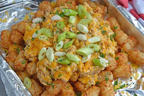 crabby-totchos-tater-tots-smothered-in-hot-crab-dip image