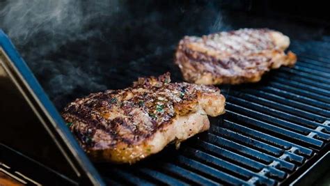 grilled-ribeye-with-garlic-herb-compound-butter-char image