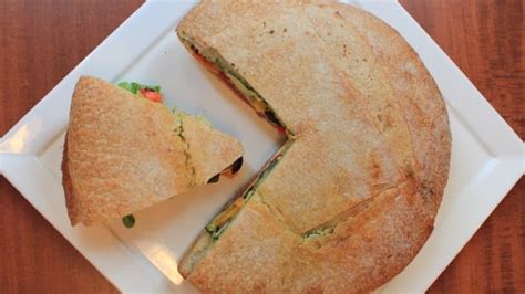 homemade-muffaletta-sandwich-with-arugula-pesto-a image