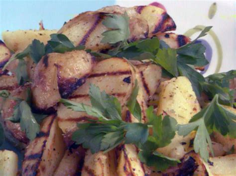 grilled-yukon-gold-potatoes-with-rosemary-lemon-garlic image