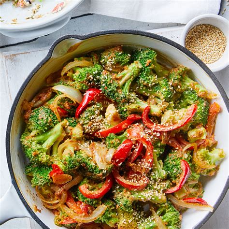 sauted-broccoli-with-peanut-sauce-recipe-eatingwell image