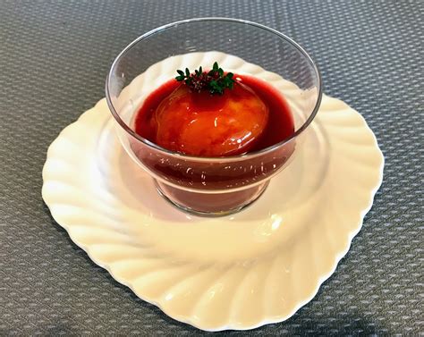 poached-peaches-with-amaretto-plum-sauce image