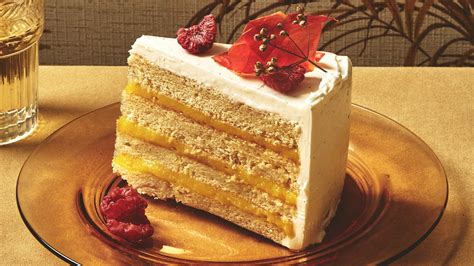 vanilla-layer-cake-with-mango-curd-recipe-bon-apptit image