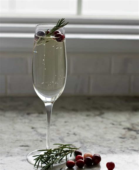 white-cranberry-mimosa-recipe-with-rosemary image