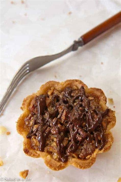 mini-pecan-pie-tarts-drizzled-with-chocolate image