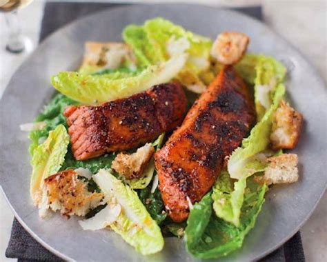 caesar-salad-with-blackened-salmon-recipe-food image
