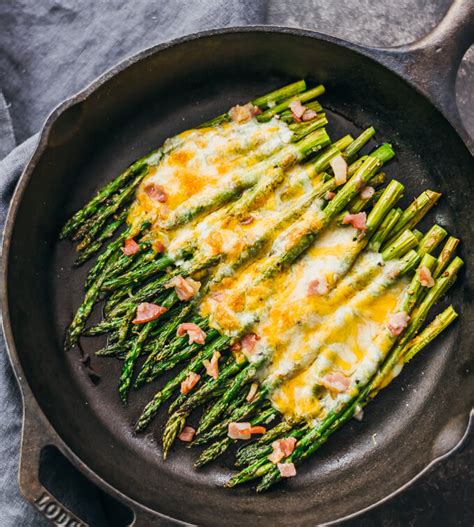 cheesy-baked-asparagus-with-bacon-savory-tooth image