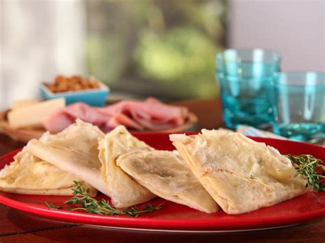 buckwheat-crepes-with-ham-gruyere-and-caramelized-onions image
