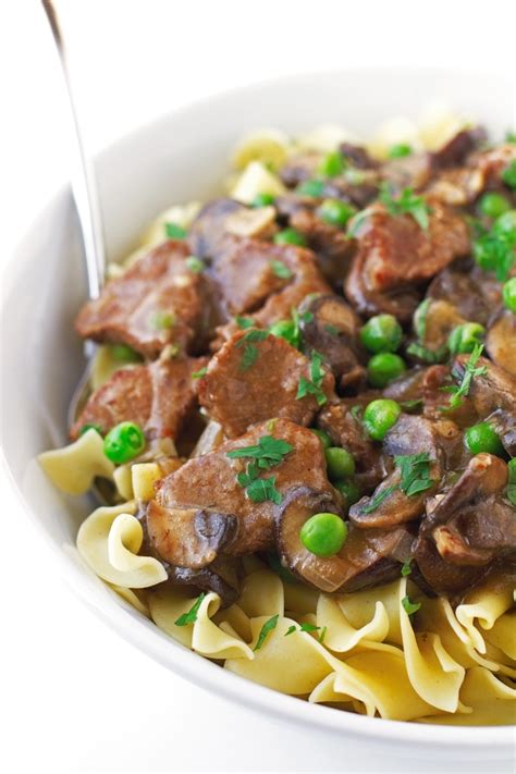 beef-stew-with-mushrooms-over-egg-noodles image