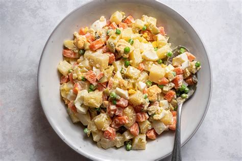 russian-potato-salad-olivye-recipe-the-spruce-eats image