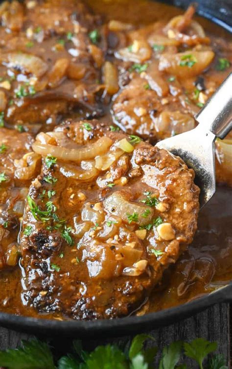 cube-steak-recipe-with-onion-gravy-butter-your-biscuit image