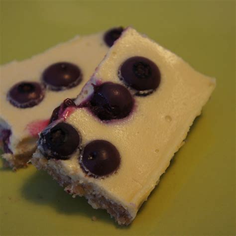 coconut-blueberry-cheesecake-bars-bigoven image