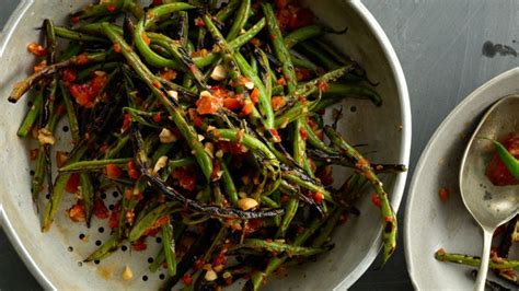 charred-green-beans-with-harissa-and-almonds image