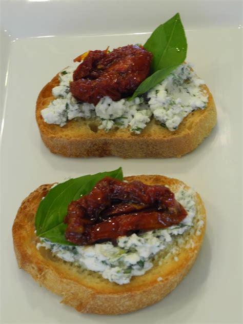 herbed-goat-cheese-and-sun-dried-tomato-crostini image