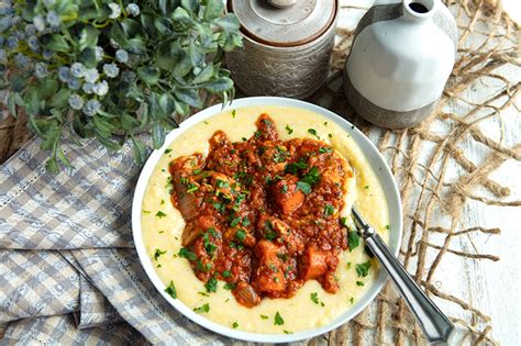 slow-cooker-pork-stew-on-creamy-polenta-italian-food image