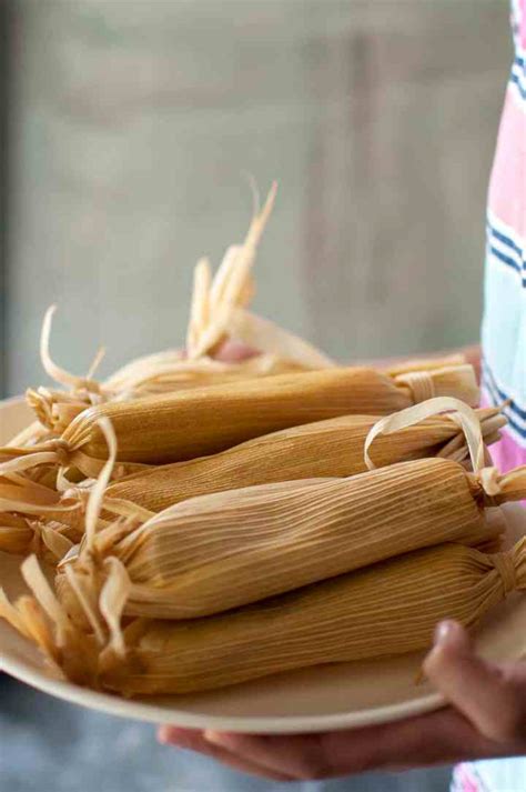 vegetarian-tamales-with-spinach-corn-and-cheese-filling image