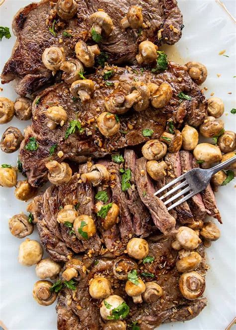 new-york-strip-steak-with-fried-garlic-mushrooms image