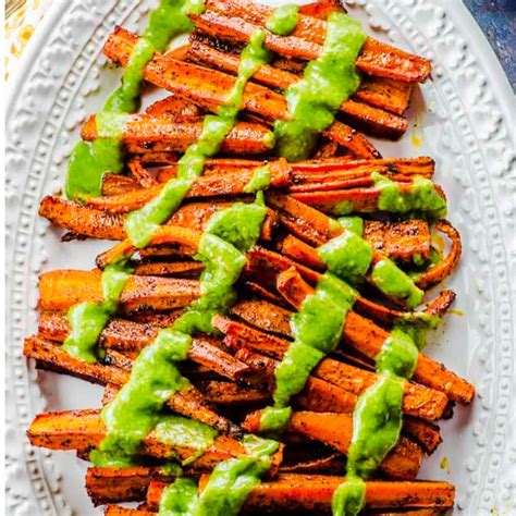 chili-roasted-carrots-with-avocado-cilantro-dressing image