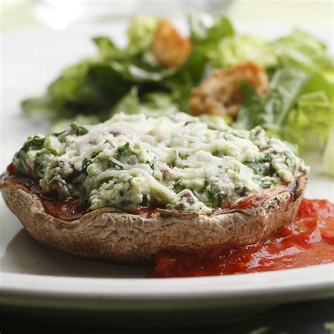 cheese-spinach-stuffed-portobellos-eatingwell image