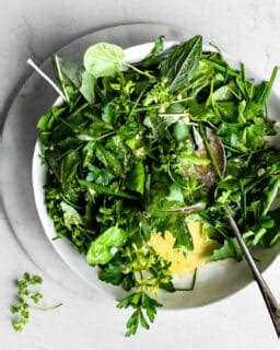 how-to-make-a-simple-herb-salad-nourished-kitchen image