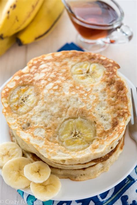 buttermilk-banana-pancakes-with-coconut-maple-syrup image