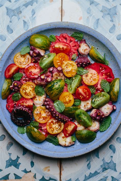 charred-octopus-salad-with-tomatoes-and-mint image