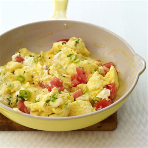 creamy-scrambled-eggs-with-scallions-and-tomatoes image