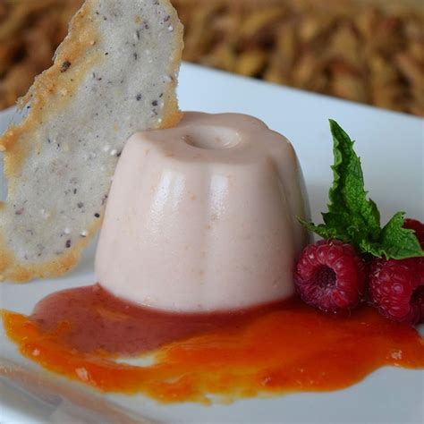 red-raspberry-panna-cotta-with-papaya-coulis-food52 image