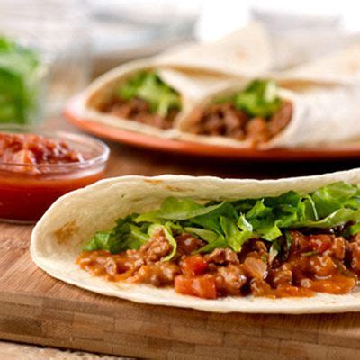 beef-and-cheddar-soft-tacos-campbells-kitchen-delish image