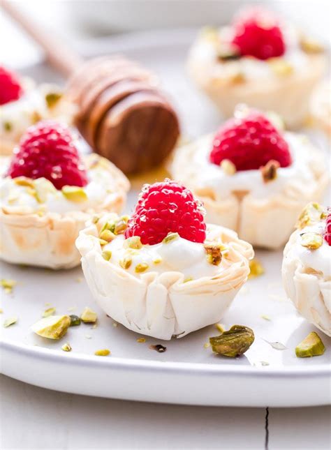 honey-goat-cheese-and-raspberry-phyllo-cups image