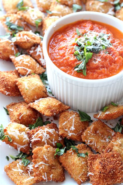 fried-ravioli-with-cheesy-marinara-dipping-sauce image