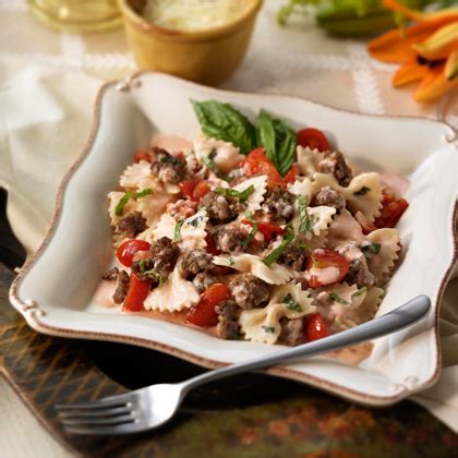 bowties-with-italian-sausage-in-a-cream-basil-sauce image
