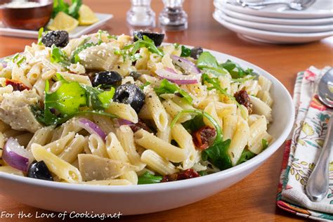 pasta-salad-with-sun-dried-tomatoes-olives-and-arugula image