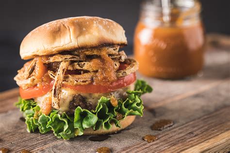 sweet-bourbon-burger-with-crispy-onion-straws-hey image