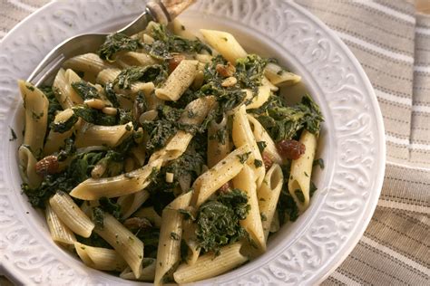 spicy-pasta-with-spinach-pine-nuts-raisins-diane-kochilas image