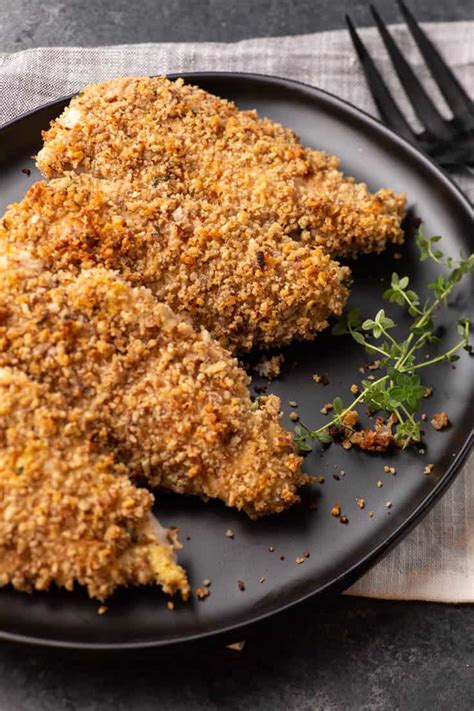 nut-crusted-chicken-with-lemon-and-thyme-butter image