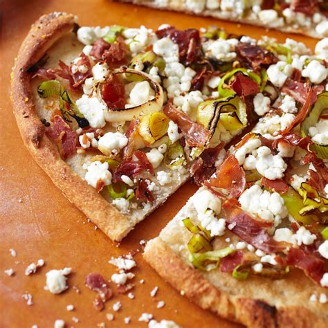 leek-prosciutto-and-goat-cheese-pizza-recipe-sur-la-table image