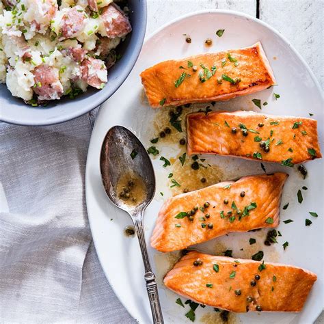 seared-salmon-with-green-peppercorn-sauce-eatingwell image
