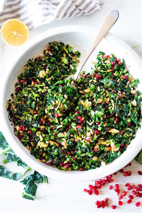 kale-farro-salad-with-almonds-and-pomegranate image