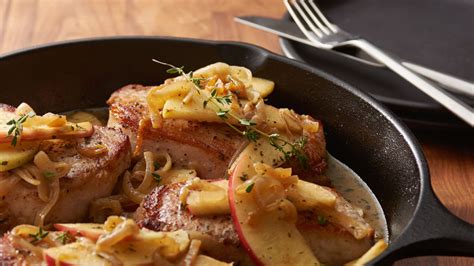 skillet-smothered-pork-chops-with-apples-and-onions image