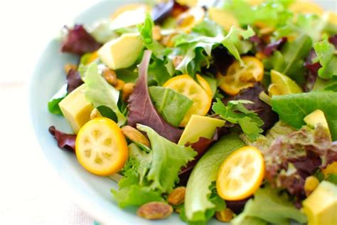 fresh-herb-salad-with-kumquats-and-pistachios image