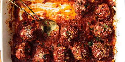how-to-make-cheesy-baked-meatballs-delish image