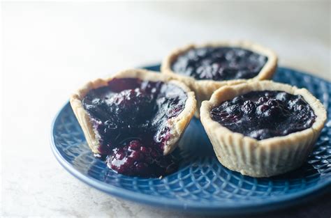 blueberry-blackberry-mini-pies-the-harvest-skillet image