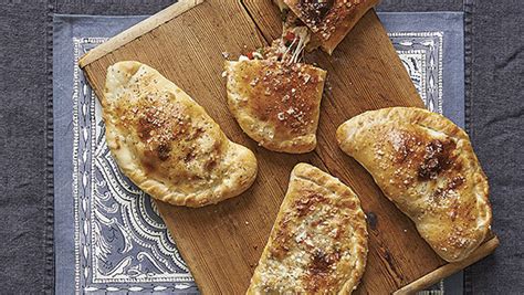 sausage-and-pepper-calzones-recipe-finecooking image